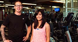young adults in front of cardio machines